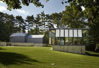 12 Modern Marvels in New England - Photo 10 of 12 - Johnson built the Wiley House at a time when the midcentury movement was booming, especially in New Canaan. While more and more architects were beginning to build minimal structures that fit into the surrounding nature, his second glass pavilion-style house was born. Unlike the Glass House, which has become a cherished relic, this home has endured through multiple life stages and has had to adapt over time.