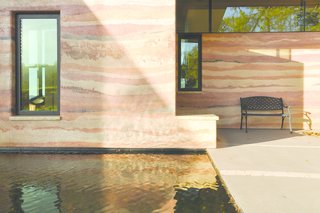 A 70-square-foot reflecting pool greets visitors as they approach the home’s elemental north entrance. 
