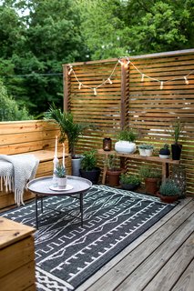 10 Ways to Use Rugs in Your Outdoor Space This Spring - Photo 1 of 10 - Modern and minimal doesn't mean unlivable—rugs make outdoor spaces inviting. 