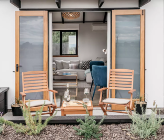 10 Rentable Homes in the World's Best Wine Regions - Photo 3 of 10 - The home also offers a spacious lounge with French doors opening to a sun drenched garden patio just meters from the vineyard.