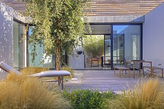 10 Rentable Homes in the World's Best Wine Regions - Photo 10 of 10 - Modern by the Sea: This airy and bright villa has plenty to offer those who want to get away from it all – a pool that’s heated year-round, expansive wooden decking, as well easy access to one of Portugal’s best-loved beaches.