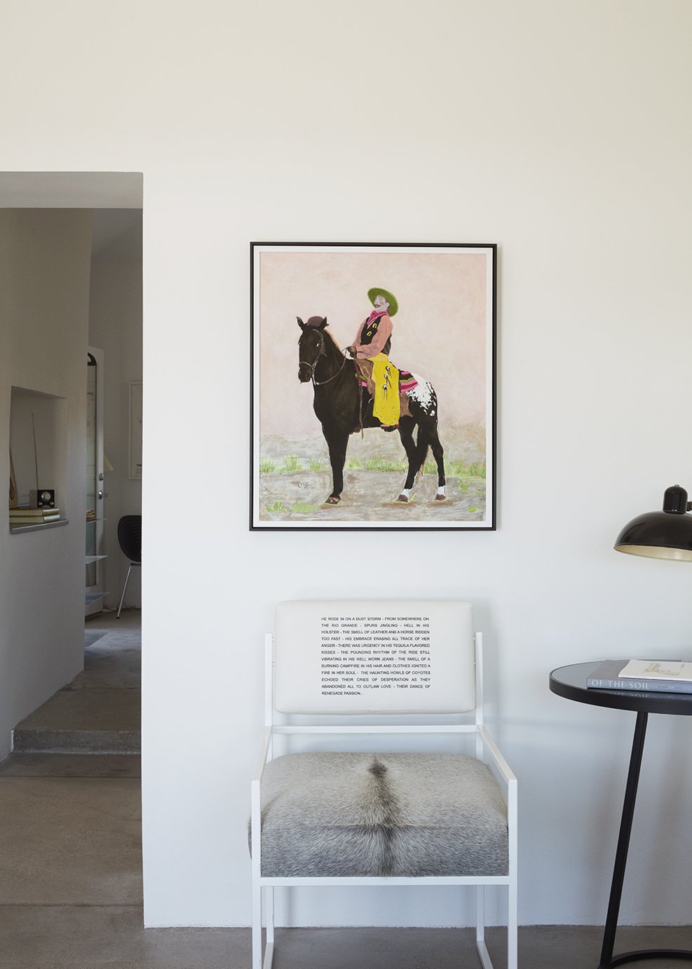 The Pee-wee Herman print that inspired the casita’s color palette hangs above a chair from Hill’s Pulpoetry series.