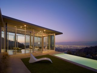 10 Modern Homes That Made a Star Appearance in Films - Photo 3 of 16 - For the Skyline Residence, Belzberg Architects made a conscious effort to build an environmentally sensitive structure, without sacrificing aesthetic and budget. Along with recycling wood framing and flooring from a nearby construction site, they sourced the low e-glazing, steel, and concrete mixes from California manufacturers.