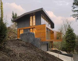 10 Modern Homes That Made a Star Appearance in Films - Photo 5 of 16 - Skylab Architecture cantilevered the living volumes in order to minimize the building’s footprint and to create a tree house-like experience for the residents.