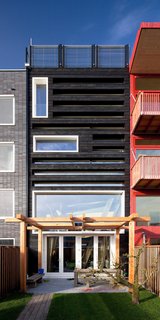 A Passive House in the Netherlands Embodies 5 Tips to Consider When Planning Your Own - Photo 1 of 5 - A pergola is located at the rear of the house. The structure provides shade in the summer and lets sun into the house during the winter.