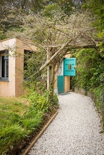 Escape For a Weekend Away at One of These Cornish Retreats That Fuse Old and New - Photo 4 of 14 - The secluded Libertine Cottage near Perranporth Beach was once an 18th-century pigsty before its owner, an ex-fashion buyer, turned it into a special hideaway that's filled with industrial furnishings and colors that pop. 