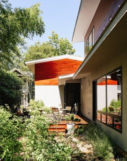 In a historic section of Raleigh, North Carolina, a modern home designed by Louis Cherry became the subject of a lengthy court battle. The house is clad in local cypress and HardiePanel siding in Stormy Monday by Benjamin Moore.