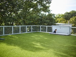 Across the Ocean - Photo 6 of 10 - A hatch door leads to the roof deck, which is lined with artificial turf. 