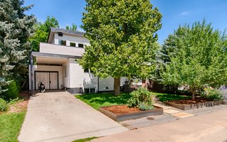 The facade has rustic overtones thanks to white-washed tongue-and-groove pine and Dryvit stucco with a limestone finish. 
