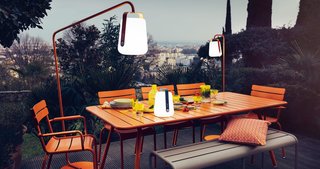 Extend Your Time Outside With These 6 Innovative Lighting Designs For Your Outdoor Space - Photo 1 of 5 - Designed by Tristan Lohner, the Balad Lamp is available in seven bold colors. It can be turned into an outdoor floor lamp by attaching it to a stand that you can purchase in a coordinating color.