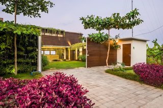 Connect With Bali's Tropical Landscape at One of these Modern Villas - Photo 6 of 10 - Located in a peaceful residential area and surrounded by lush paddy fields, this three-bedroom house is made out of shipping containers and has a sunken outdoor conversation pit that’s perfect for evening cocktails.