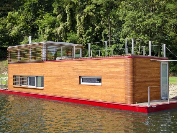 10 Modern Floating Homes That Offer an Aquatic Lifestyle - Photo 8 of 10 - This full-fledged floating house was designed with features that are meant to live comfortably year-round.