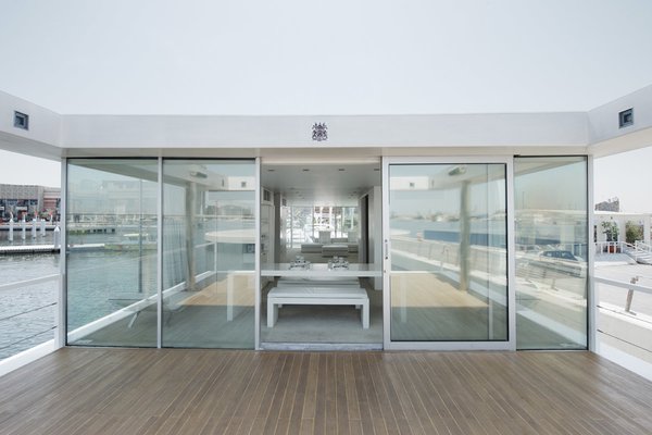 10 Modern Floating Homes That Offer an Aquatic Lifestyle - Photo 9 of 10 - X-Architects closely collaborated with Leen Vandaele, to construct a terrace with a spiral staircase that can be used as a sun deck.