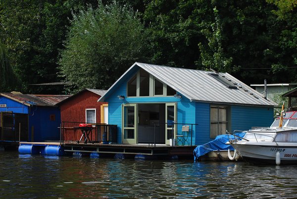 10 Modern Floating Homes That Offer an Aquatic Lifestyle - Photo 10 of 10 - This project was reconstructed from an old houseboat that was anchored in the sailing club in Smichov.