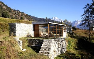 Hide Out in One of These Asian Retreats That Are Immersed in Nature - Photo 5 of 12 - Enjoy fresh mountain air and get a bird’s eye view of the Himalayas at Shakti 360º Leti, which consists of four private stone, glass, and wood cabins that sit high on the peaks of the India-Nepal border (also shown in the cover photo).