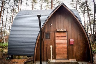 Hide Out in One of These Asian Retreats That Are Immersed in Nature - Photo 7 of 12 - This cozy two-bedroom hut in the Japanese ski resort area of Hakuba Misorano is built with red cedar timber and surrounded by trees—which offer plenty of privacy.