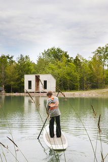 Hot to Trot - Photo 5 of 11 - Cooper, 11, <br>paddleboards toward an outbuilding that contains a sauna. 