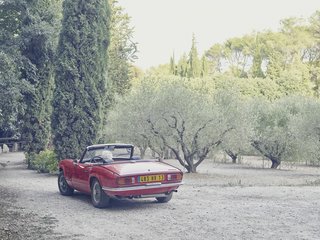 Mine Dining - Photo 15 of 18 - Lolo eases his Triumph Spitfire convertible, designed by Giovanni Michelotti, into the driveway. 