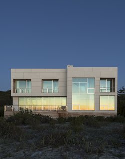 When Superstorm Sandy struck the East Coast in fall 2012, Margaret and Bob Bombara were in the middle of planning their long-awaited beach house on Long Island’s North Fork. The disaster, which flooded their main home in Queens, gave them pause. For architect John Berg, it underscored a vital fact—the Bombaras’ vacation house would need to be able to stand up to high wind, heavy rain, and intense storm surges. 