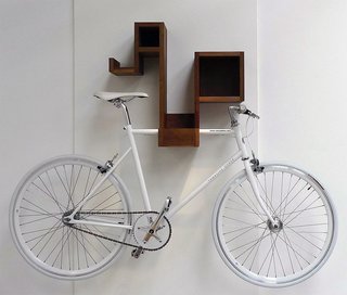 10 Functional Pieces For Small Space Living - Photo 1 of 11 - A bicycle rack for the design-conscious cyclist, the Pedal Pod looks good with or without your bicycle. The multifunctional piece offers ample cubby space to stash odds and ends, and frees up floor space while storing your bike.