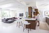 Modern home with Kitchen and Engineered Quartz Counter. A 1953 by Curtis and Davis in New Orleans’s Lakeshore neighborhood proved too tempting to pass up for veteran renovators Maury Strong, a film producer with an A-list client roster, and Ron Caron, a public school teacher. But the couple soon discovered that the flood-damaged structure with multiple sloppy renovations was a bigger challenge than they had imagined. With the help of a team led by Wayne Troyer and Natan Diacon-Furtado of studioWTA and the original architectural plans, they created a modern oasis to last a lifetime. Photo of Emerald Street Residence modern home