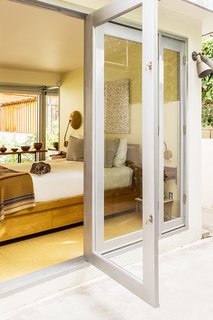 Custom folding doors, inspired by Rudolf M. Schindler’s 1930 Elliot House, were created by Rene Maya to Andrew’s specifications. 