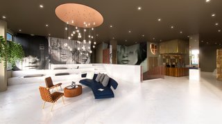 "The street art featured in the property was commissioned by a local artist. We felt partnering with a local artist would instill a strong sense of local heritage within Collegiate Marquês de Pombal. We did provide a vague brief, but we also wanted him to follow his own inspiration, so the very final result will partly be a surprise for us all." - Design Command. Pictured is the Reception Area.
