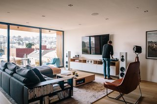 Domino Effect: How a Bedroom Refresh Jump-Started a Whole-House Remodel For a Tech Exec - Photo 12 of 14 - Sonos speakers are wired throughout the house, complemented by Magico S3 standing speakers in the family room. The leather Lama lounger is by Ludovica and Roberto Palomba for Zanotta. 