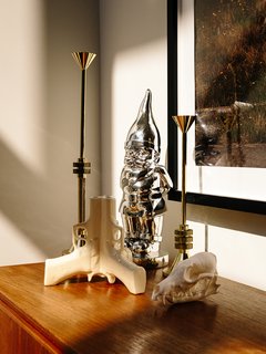 Domino Effect: How a Bedroom Refresh Jump-Started a Whole-House Remodel For a Tech Exec - Photo 7 of 14 - A pair of Tom Dixon Cog candle holders and a 3Guns vase by Suck UK are assembled atop a vintage teak sideboard. 