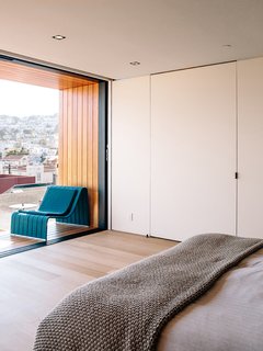 Domino Effect: How a Bedroom Refresh Jump-Started a Whole-House Remodel For a Tech Exec - Photo 4 of 14 - A special media door opens to reveal the bedroom’s AV system.