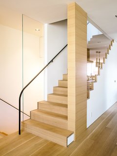 Domino Effect: How a Bedroom Refresh Jump-Started a Whole-House Remodel For a Tech Exec - Photo 3 of 14 - The staircase follows the bedroom's new primary material, French white oak. 