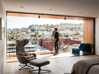 Tom Conrad and Kate Imbach’s first bedroom redo created as many problems as it alleviated, blocking their view of Noe Valley behind a wall, for instance. Their second attempt, shown here, opened up the balcony, which has a Frame lounge by Francesco Rota for Paola Lenti. A Grand Repos chair by Antonio Citterio for Vitra faces the bed.