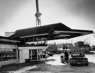 Frank Lloyd Wright's Little Known Gas Station For the Future - Photo 1 of 2 - The building features a cantilevered copper canopy and is primarily made of concrete, glass, and steel. There's a glass observation lounge on the second floor for community interaction. Cypress, one of Wright's favorite materials, is used throughout the interior. Photo circa 1963.