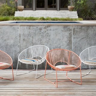 15 Modern Outdoor Seating Pieces To Take You Into Summer - Photo 1 of 5 - Created by Coyoacán Design Studio, these playful chairs are available as a limited edition series from The Citizenry. Handcrafted in Mexico City with powder-coated steel, they come with a handwoven cushion that’s made by a fair-trade cooperative in Peru. Each chair takes almost two days to complete. 