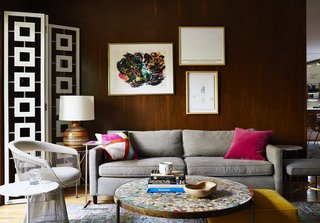 How to Update a Midcentury Modern Gem - Photo 10 of 12 - A Petal end table by Richard Schultz is paired with a Platner armchair. These classics mingle with newer items, such as a Desmond room divider by Jonathan Adler and a sofa by Mitchell Gold + Bob Williams.