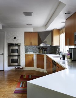 How to Update a Midcentury Modern Gem - Photo 2 of 12 - The residents added double-glaze windows, low-VOC paints, and Energy Star appliances, calling on help just once, to install the Cambria quartz countertop in the kitchen. 