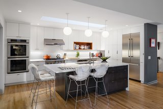 Minor Adjustments - Photo 4 of 7 - In the renovated kitchen space, Dianne chose quartz counters in Blizzard by Caesarstone. 