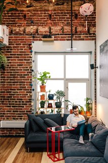 Devising Clever Solutions For a Small San Francisco Loft - Photo 1 of 10 - Inside his San Francisco living room, Max Heinritz kicks back on a Söderhamn sectional from IKEA. "In Tokyo, everything is space-efficient, nothing is wasted," he says. "I'm sort of going for that, too."