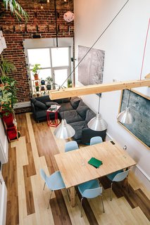 Devising Clever Solutions For a Small San Francisco Loft - Photo 7 of 10 - "I wanted to have a cozy dining area, so I thought about how I could do it in a way that wouldn't impede the projector," says Max. He mounted the device, a ViewSonic, atop the living room window. 