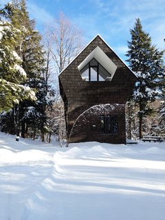 The new 1,300-square-foot home is tucked away in southeastern Quebec. 