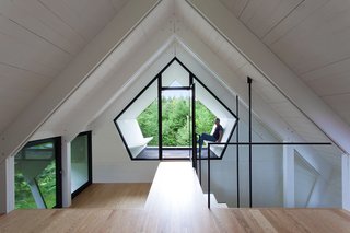 The pentagonal geometry of the third story is echoed an Alumilex window. 