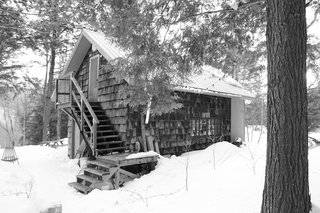 By building upward and outward, YH2 Architecture added to a former lumberman’s shed without harming the nearby trees. 