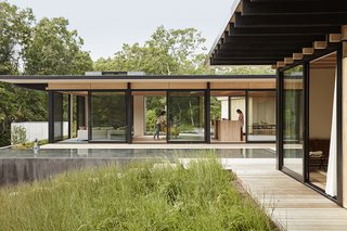 Sliding walls of glass by Arcadia are situated throughout. 