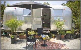 8 Ways to Renovate an Airstream - Photo 8 of 8 - "I found the Airstream in the high desert of Anza, California, and thought it was a pure TLC job. Wishful thinking!" says interior designer Caroline Brandes, who also rents renovated Airstreams on her property in Big Sur through Big Sur Getaway. "Even though the interior looked decent, once back home in Big Sur I had discovered water leaks, extensive floor rot under the linoleum tiles, and even frame damage." She hired Area 63 Productions, a professional Airstream renovation company, to help. 