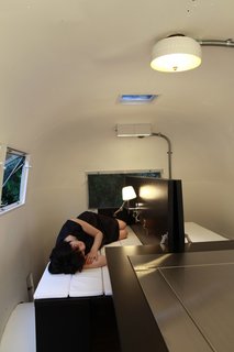 8 Ways to Renovate an Airstream - Photo 6 of 8 - Much like traditional Japanese futon beds, the mattress hidden in the table folds out for a softer place to sleep. 