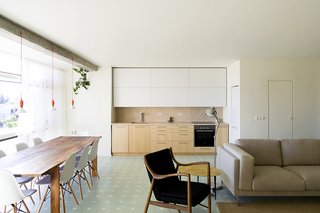 Lisbon Vision - Photo 5 of 5 - A Nockeby sofa from IKEA and a 45 Chair by Finn Juhl provide seating in the living area.
