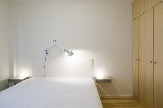 Lisbon Vision - Photo 4 of 5 - The bed, nightstands, and cabinets were all designed by Miguel Marcelino. The Glo-Ball bedside lamps are by Jasper Morrison and the Tolomeo wall lamp is by Michele De Lucchi. 