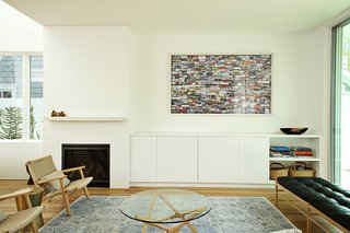 Two Grad-School Friends Apply Their Know-How to a Manhattan Beach Bungalow - Photo 3 of 9 - Beside the fireplace is a Nexus 21 lift system, which is used to hide the television when it’s off. 