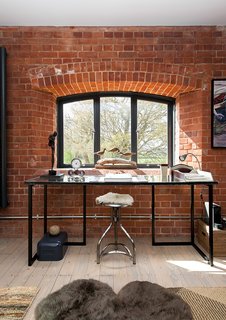 A Refurbished Victorian-Era Brick Tower in Hampshire - Photo 3 of 9 - The tower, which now holds a study and several other living spaces, was in disrepair. Its original brickwork had to be washed inside and out, and the exterior was coated with a hydrophobic mineral paint by Keim to make it harder for rain to penetrate. 