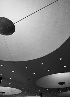 Ode to a Forward-Thinking America: Columbus, Indiana - Photo 4 of 18 - Saarinen’s overhead lighting was unusual: Concave expanses hold custom fixtures, while a constellation of smaller embedded bulbs plays up the feeling of space. 